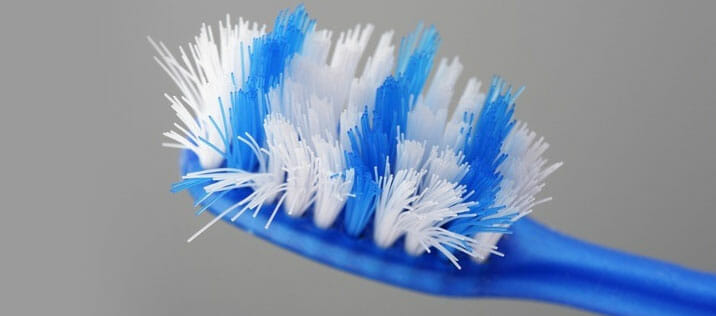 Using-a-brush-with-too-firm-bristles